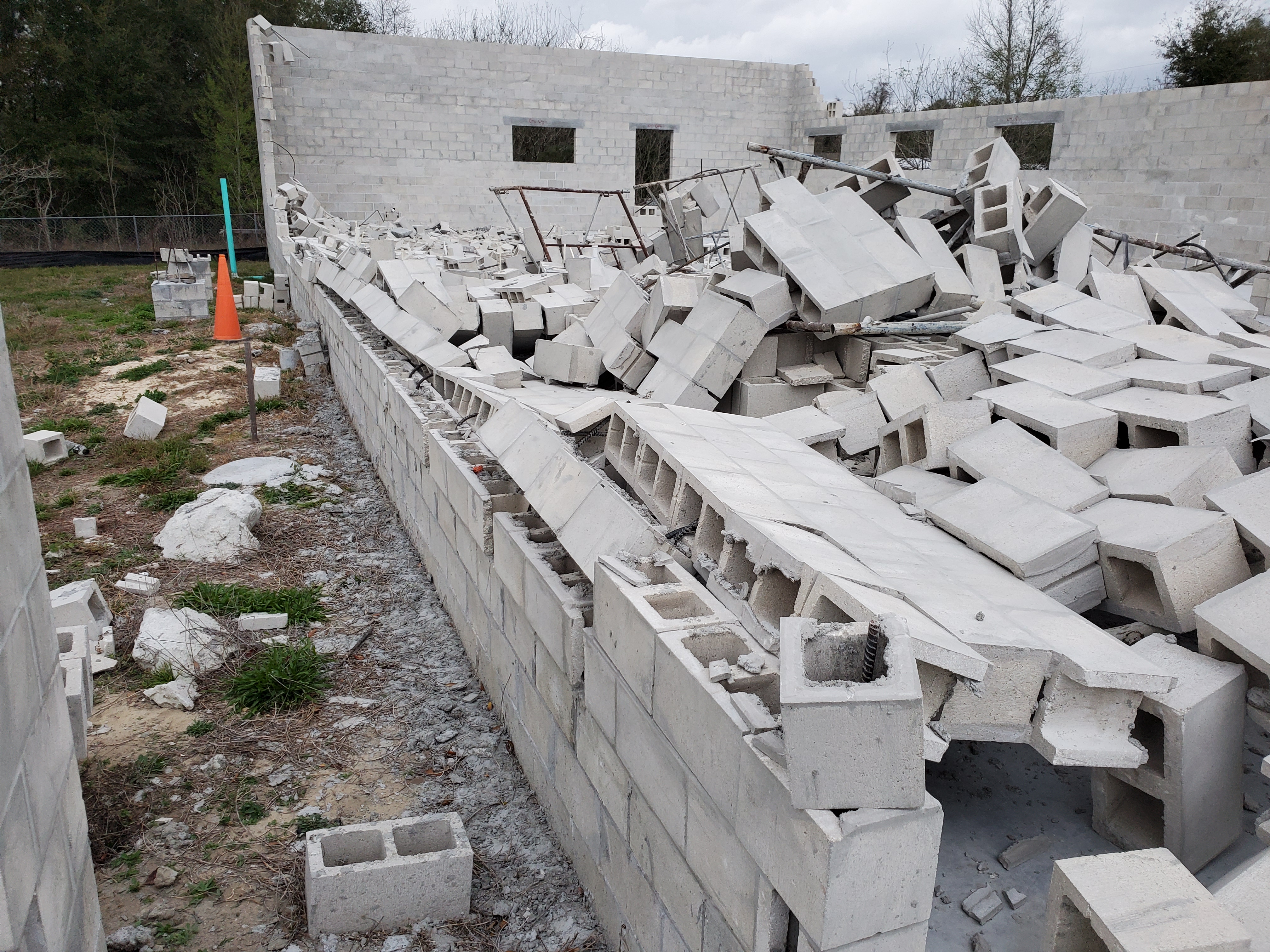 The tornado knocked down the wall before we could pour in concrete.